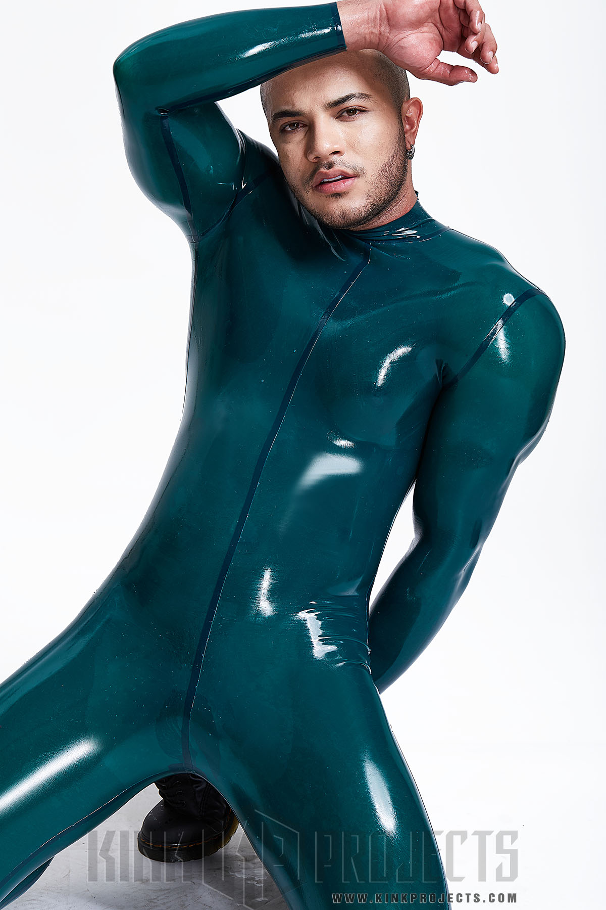 Men's latex catsuit with figure forming corset belt.